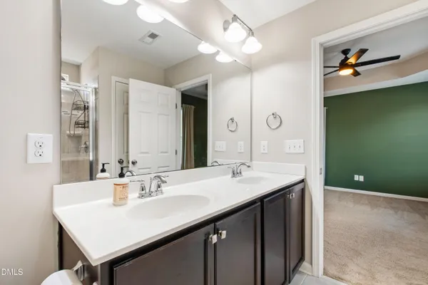 a bathroom with a glass shower door