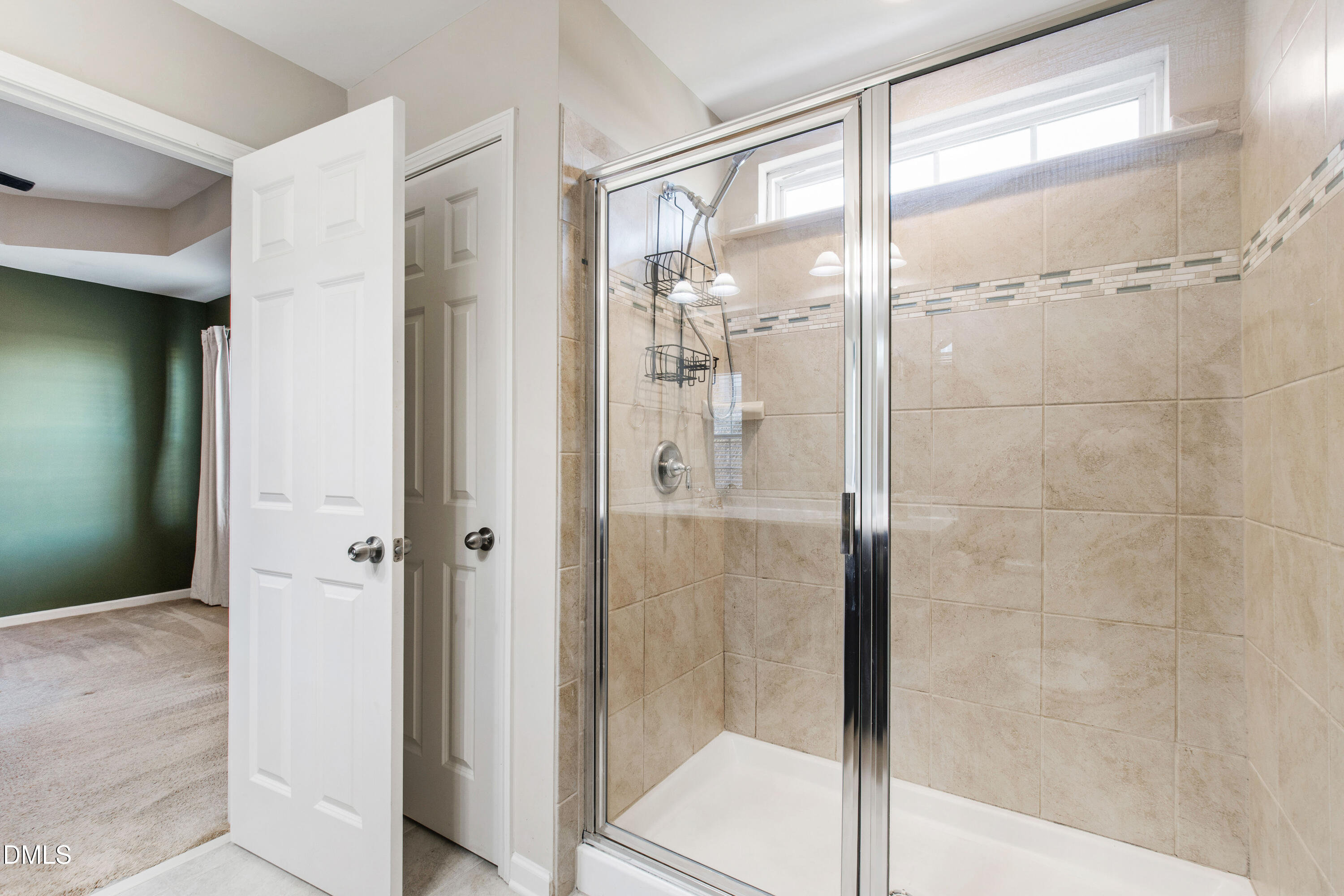1118 Renewal Place Raleigh, NC 27603 - Photo 22 of 38 a bathroom with a glass shower door