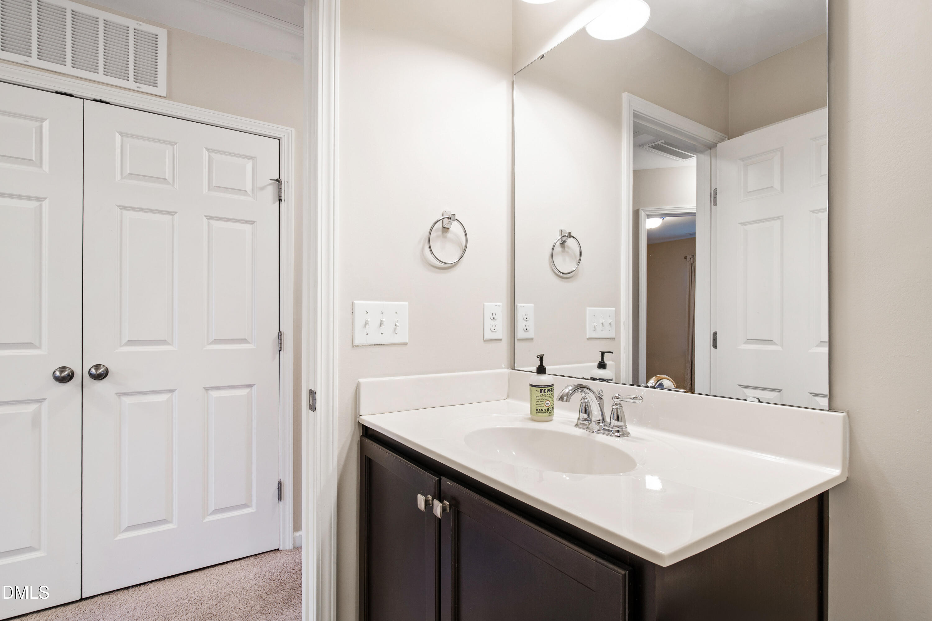 1118 Renewal Place Raleigh, NC 27603 - Photo 25 of 38 a bathroom with a sink and a mirror
