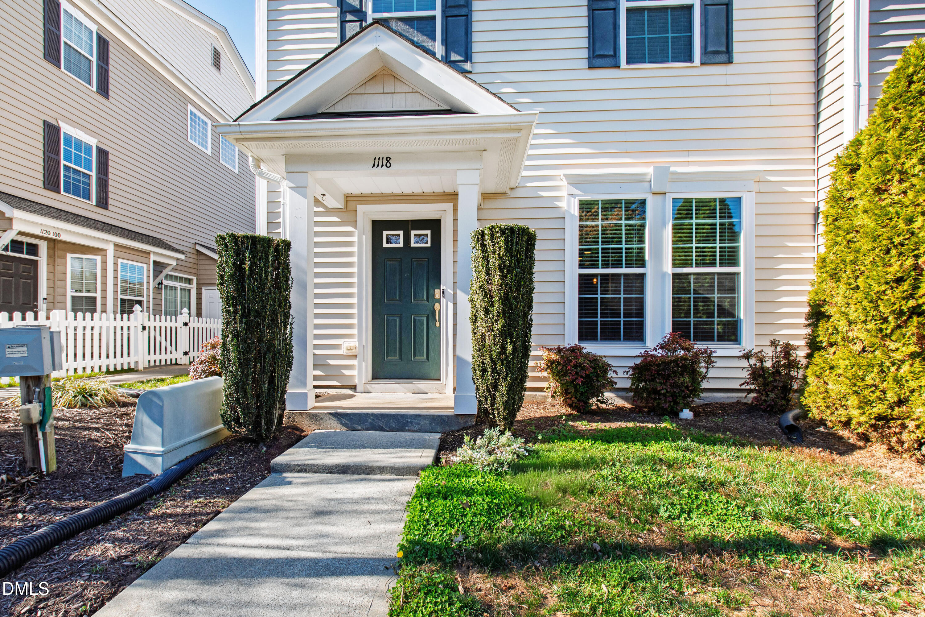 1118 Renewal Place Raleigh, NC 27603 - Photo 3 of 38 a front view of a house with a yard