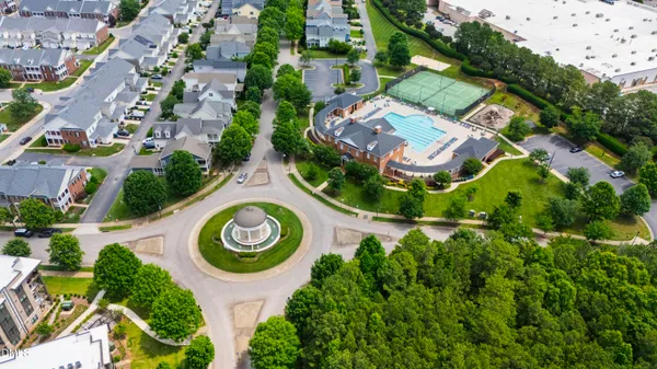 an aerial view of a house with a swimming pool yard and outdoor seating