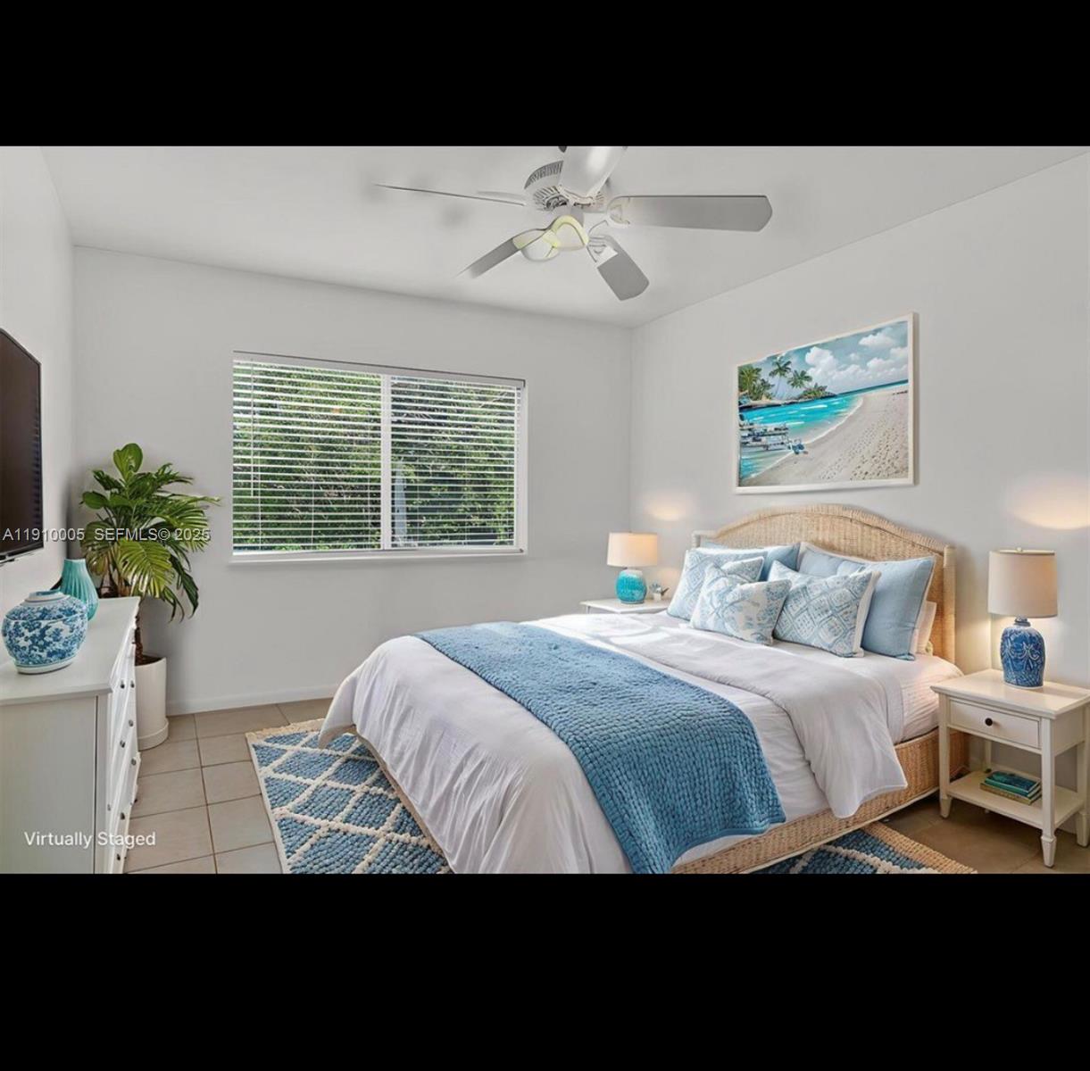 184 Adobe Casa Ct Drive, Unit 184 Tavernier, FL 33070 - Photo 3 of 9 a bedroom with a bed and a painting on the wall