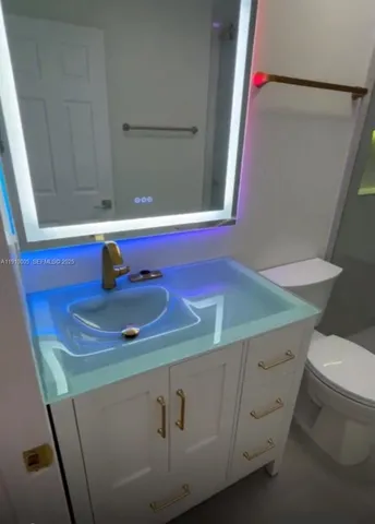 a bathroom with a sink and a toilet