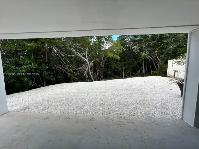 a view of a large window with yard view