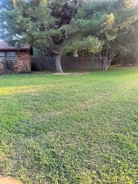 2736 Chebi Lane Denton, TX 76209 - Photo 2 of 17 a view of a yard with a house in the background