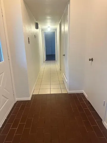 a kitchen with stainless steel appliances a sink a stove a microwave and cabinets