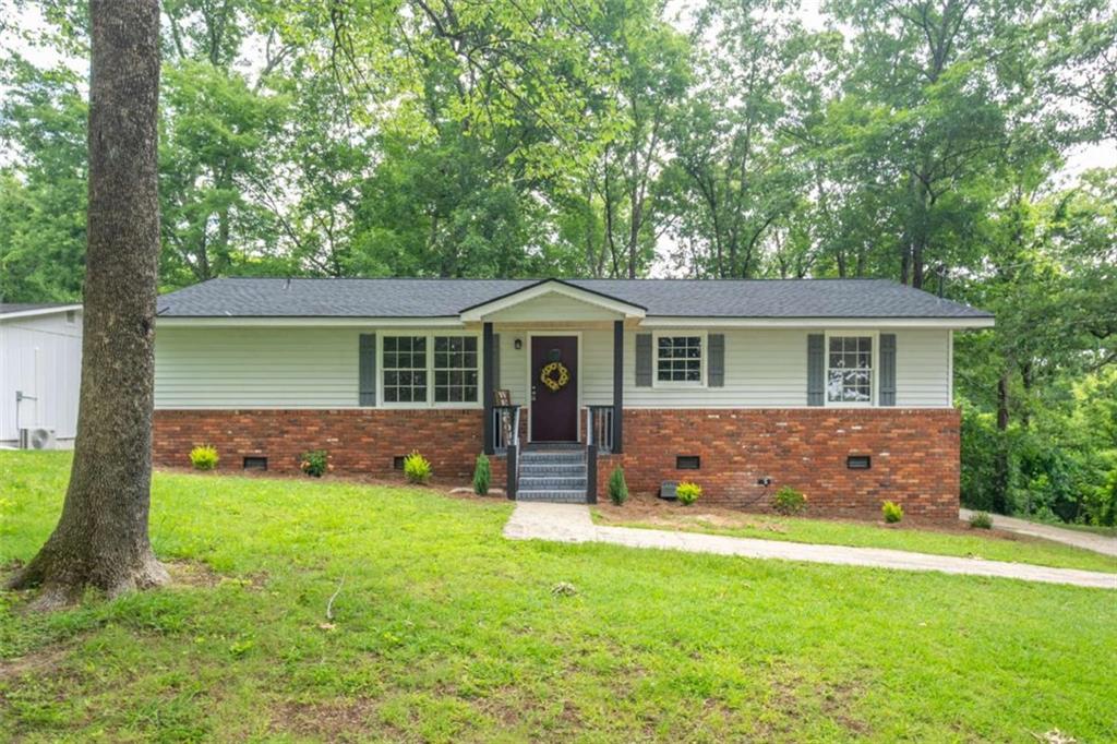 24 Marlene Drive Northeast Rome, GA 30165 - Photo 1 of 1 front view of a house that has a yard