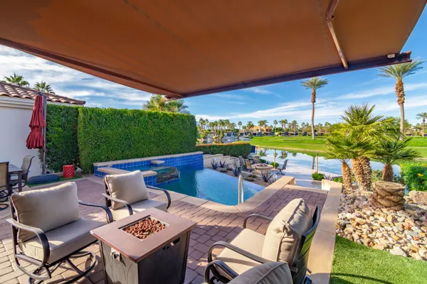 a view of a chairs and table in a patio