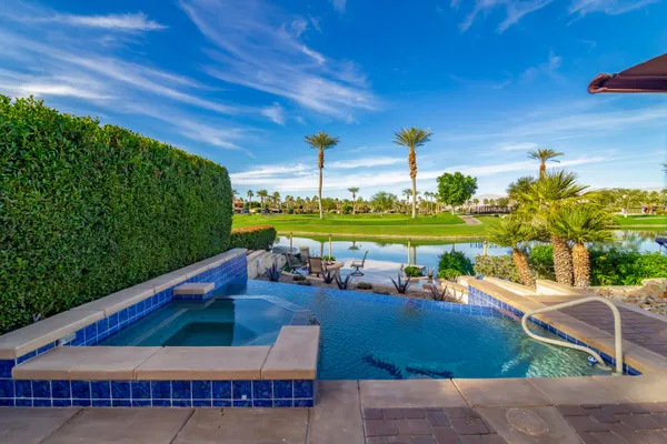 a table and chairs sitting in front of a house
