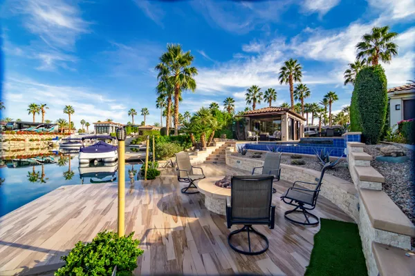 an aerial view of a house a yard and a fountain