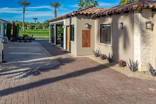 a kitchen with kitchen island a counter top space a sink and wooden floor