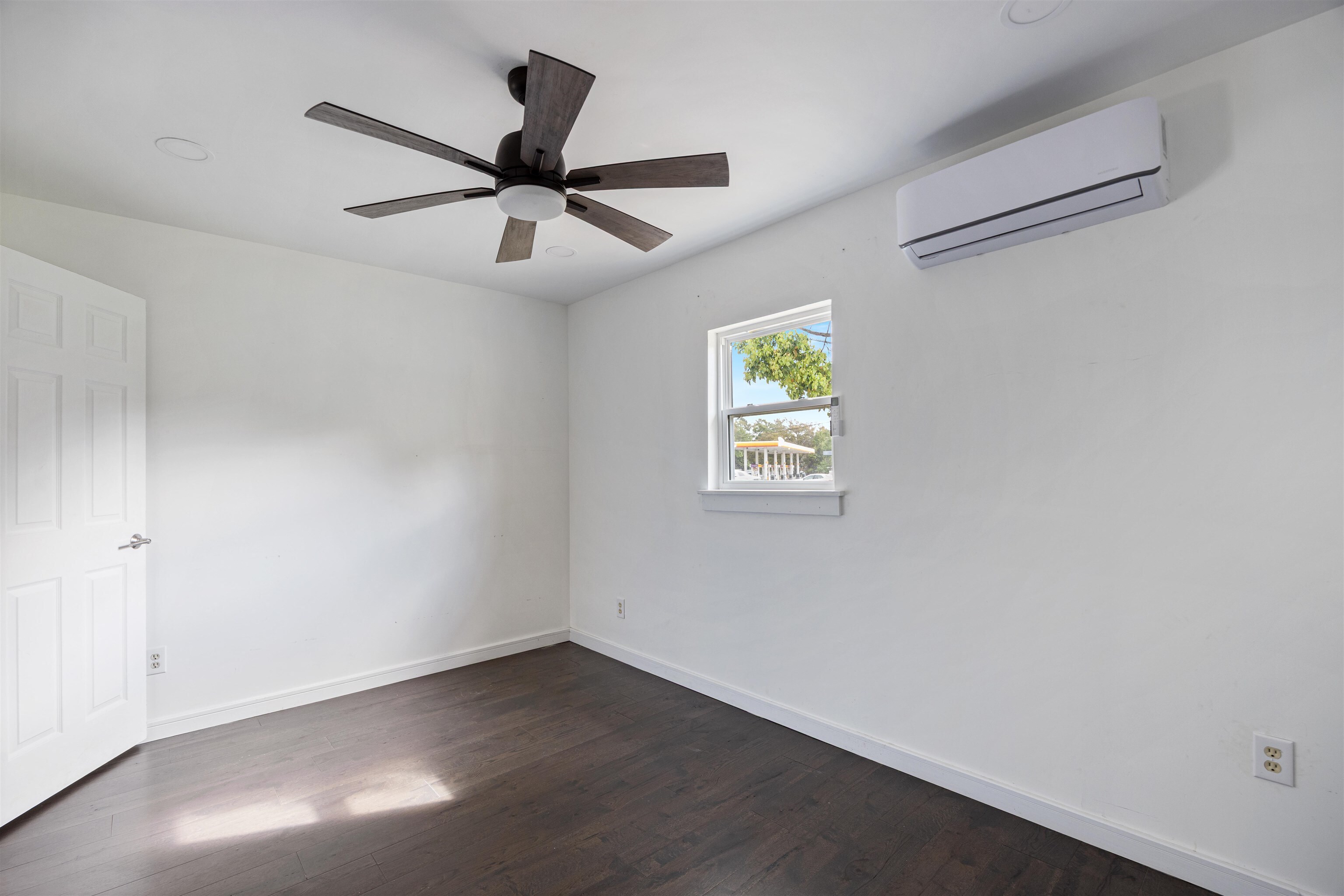 112 South Juniper Street Foley, AL 36535 - Photo 9 of 64 Spare room with dark wood-type flooring and ceiling fan