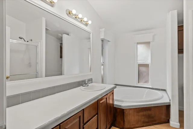 a bathroom with a sink a vanity and a mirror
