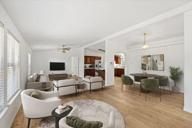 a living room with furniture or couch and a wooden floor