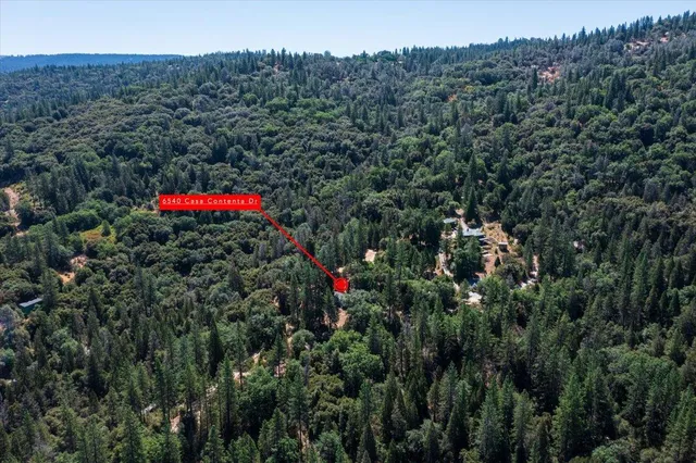 a kitchen with granite countertop a sink stove and cabinets