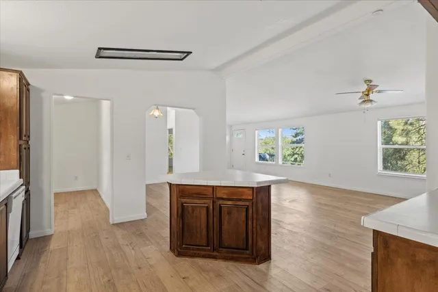 a view of a kitchen cabinets a wooden floor and a sink