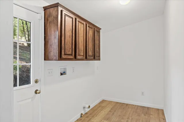 a bathroom with a window and a shower