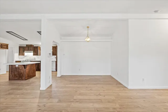 a view of a kitchen with wooden floor