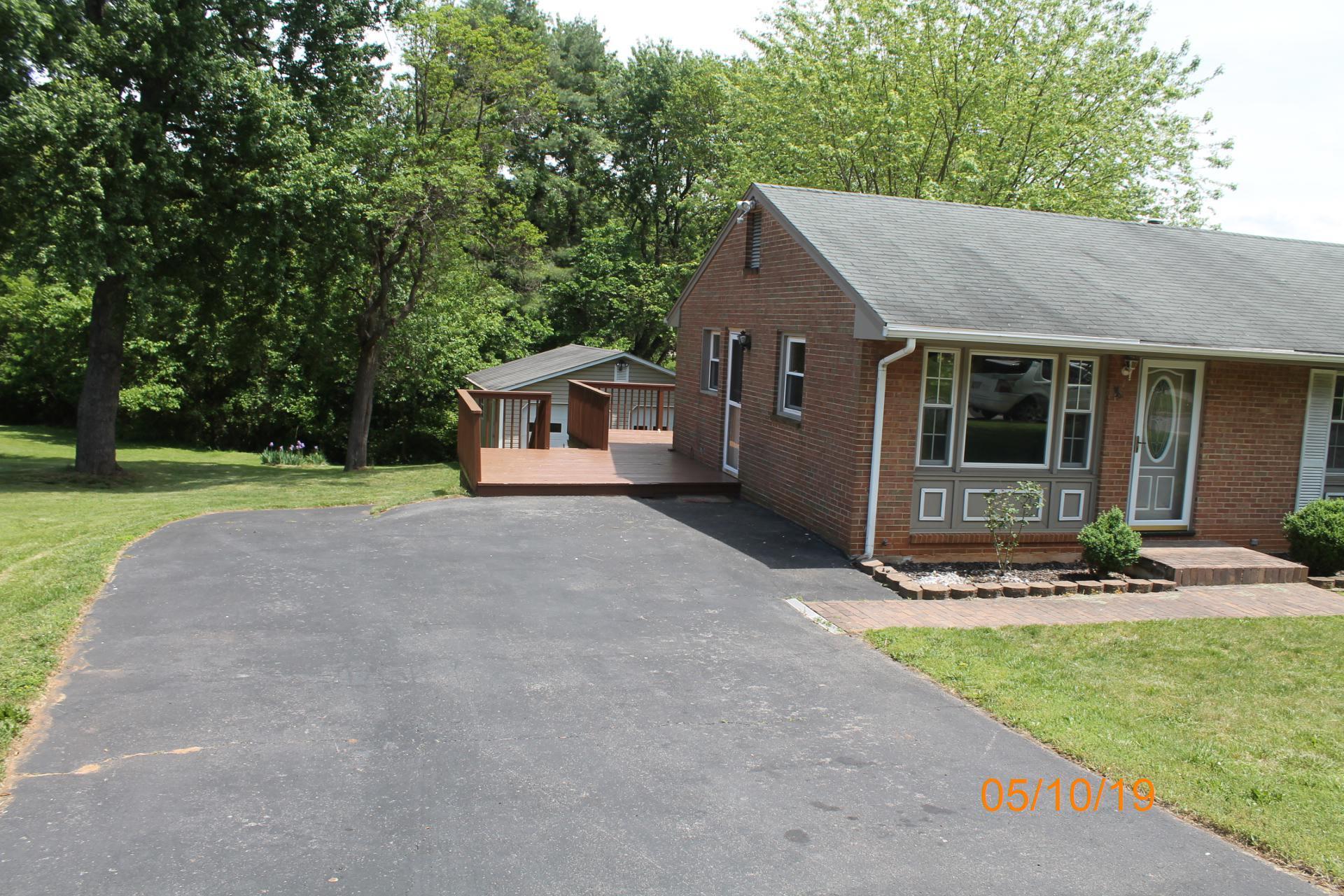 745 Kenyon Road Vinton, VA 24179 - Photo 13 of 52 a front view of a house with garden