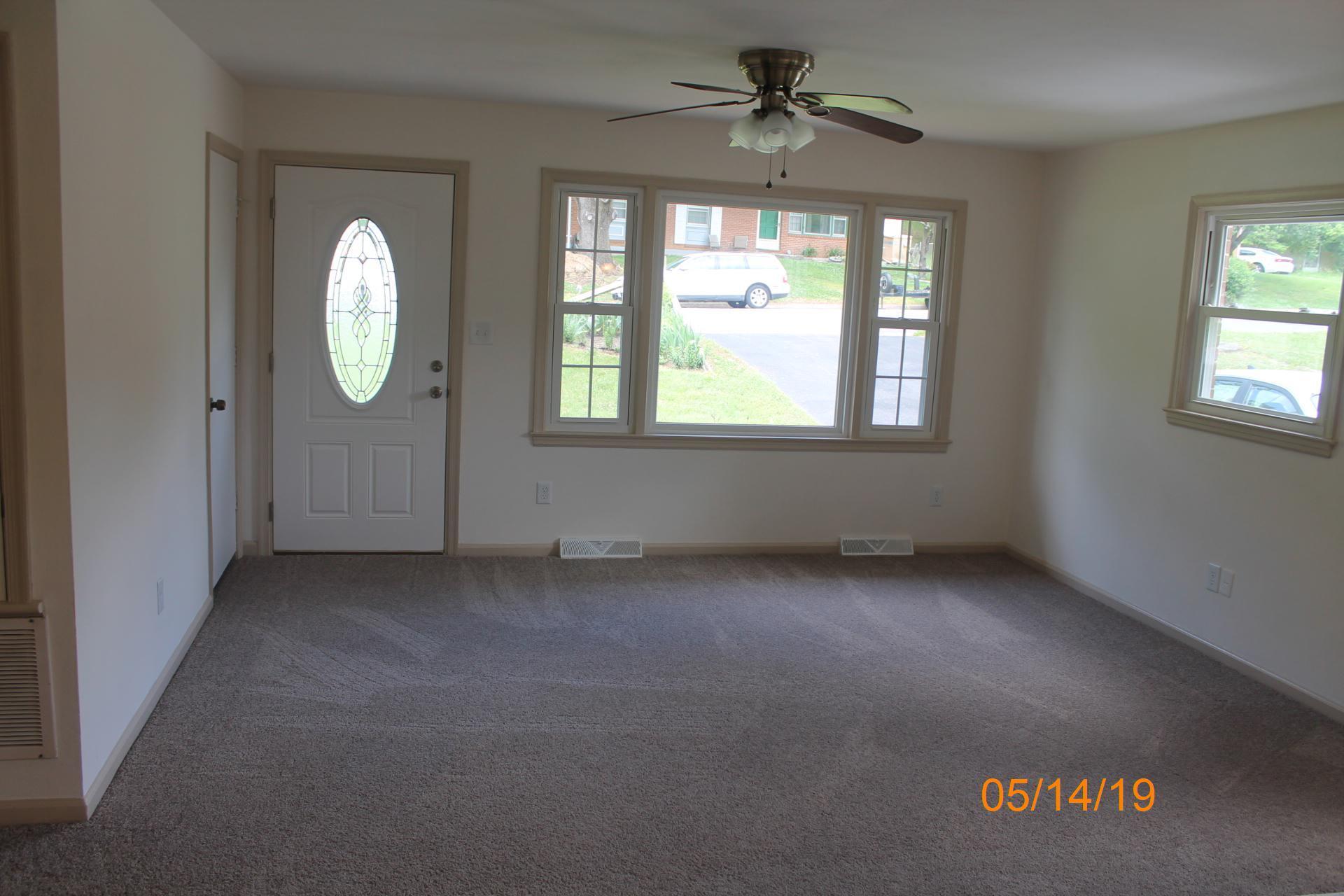 745 Kenyon Road Vinton, VA 24179 - Photo 16 of 52 an empty room with windows and fan