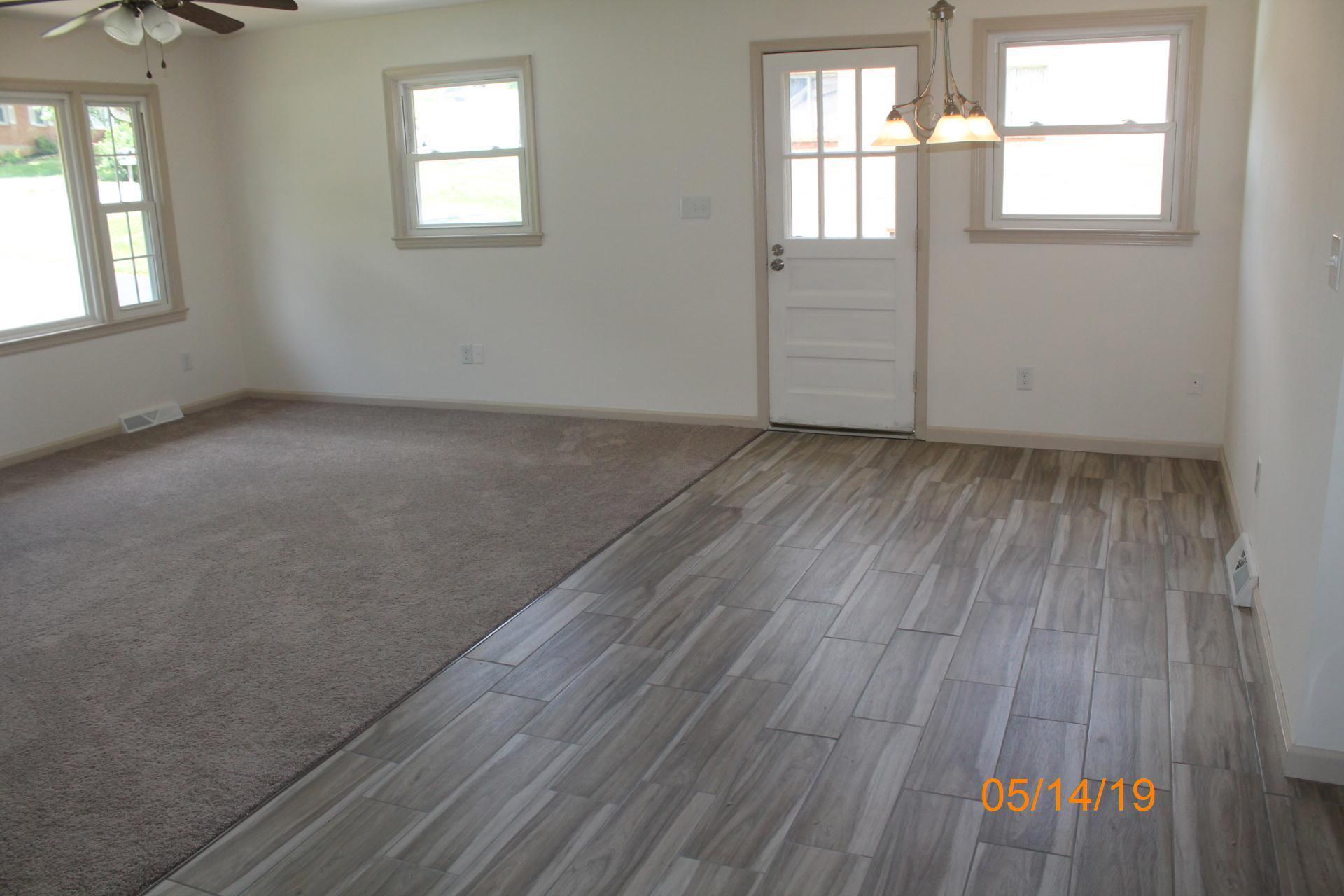 745 Kenyon Road Vinton, VA 24179 - Photo 19 of 52 an empty room with wooden floor and windows