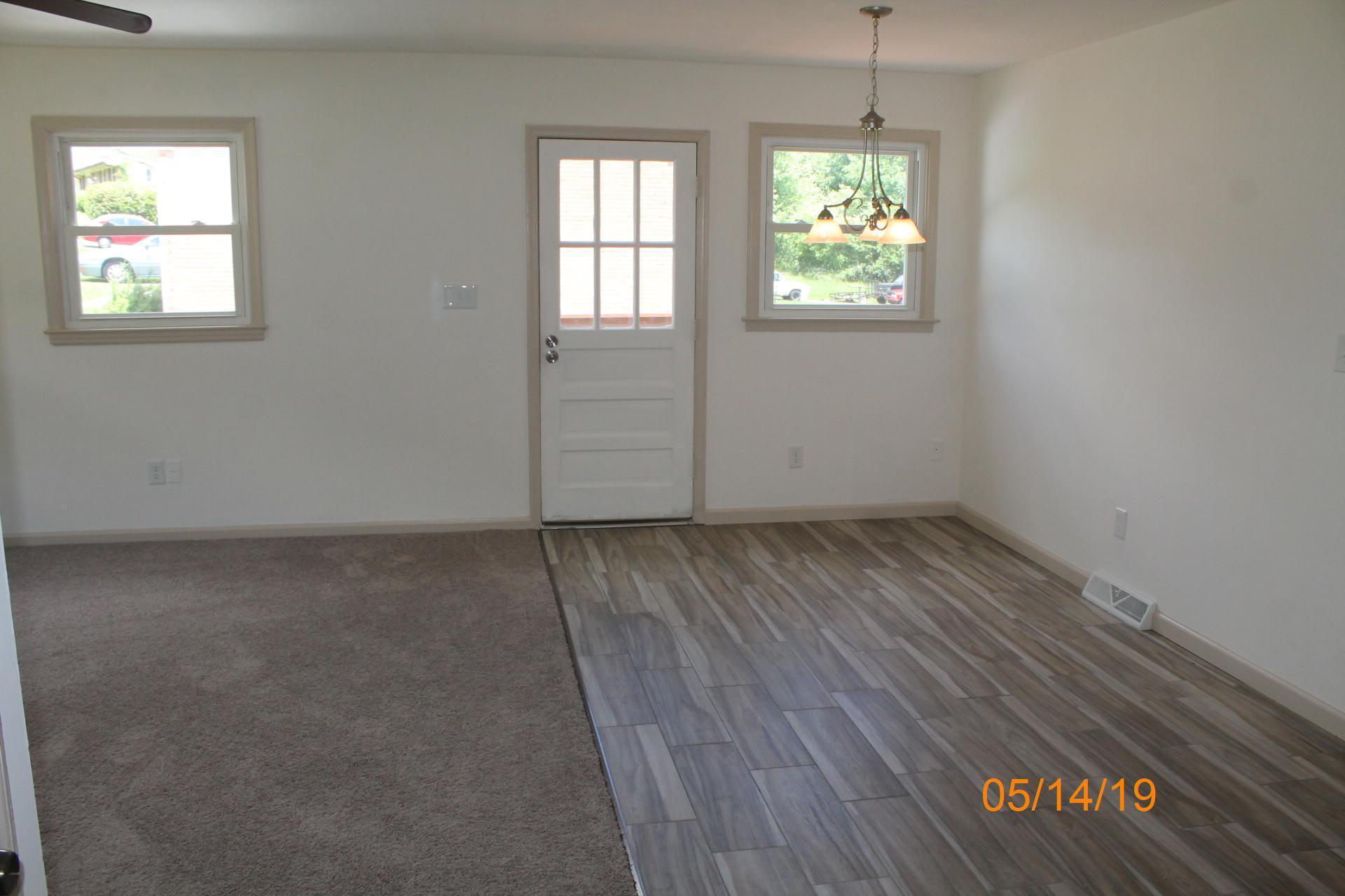 745 Kenyon Road Vinton, VA 24179 - Photo 20 of 52 an empty room with wooden floor and windows