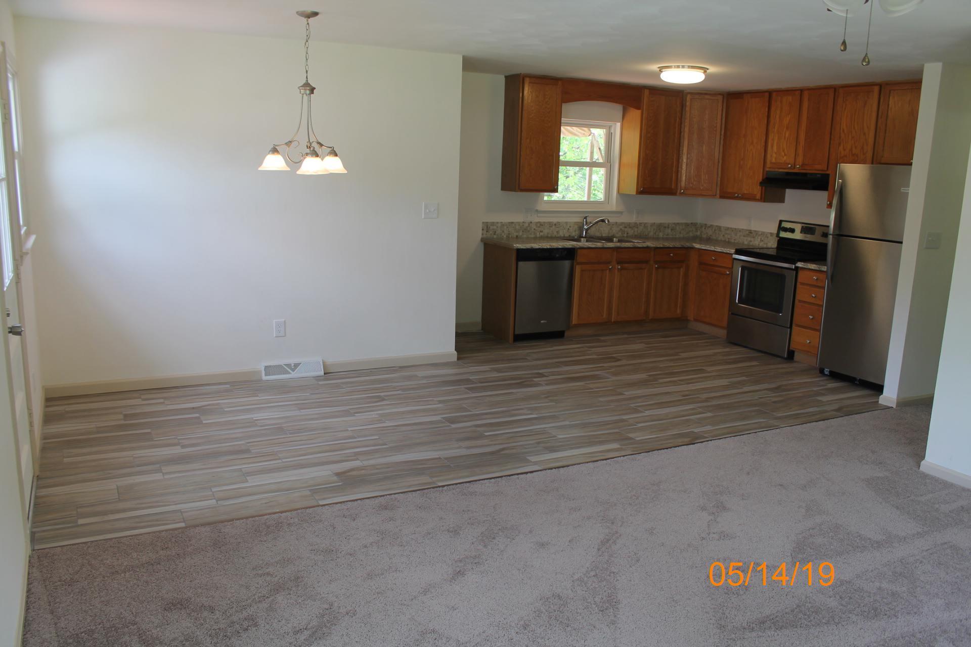 745 Kenyon Road Vinton, VA 24179 - Photo 23 of 52 a kitchen with stainless steel appliances granite countertop a sink and a refrigerator