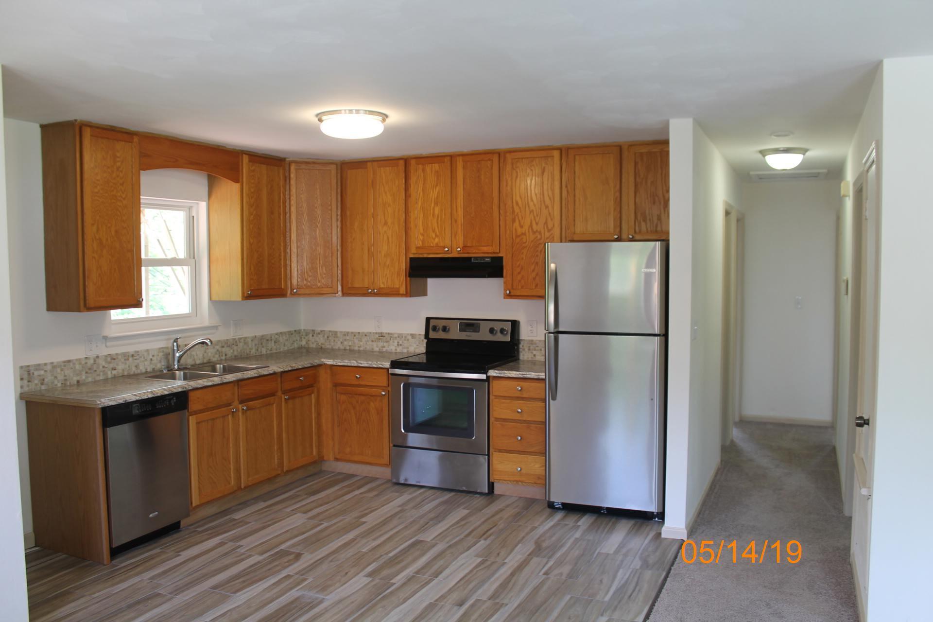 745 Kenyon Road Vinton, VA 24179 - Photo 26 of 52 a kitchen with granite countertop stainless steel appliances a refrigerator sink and cabinets