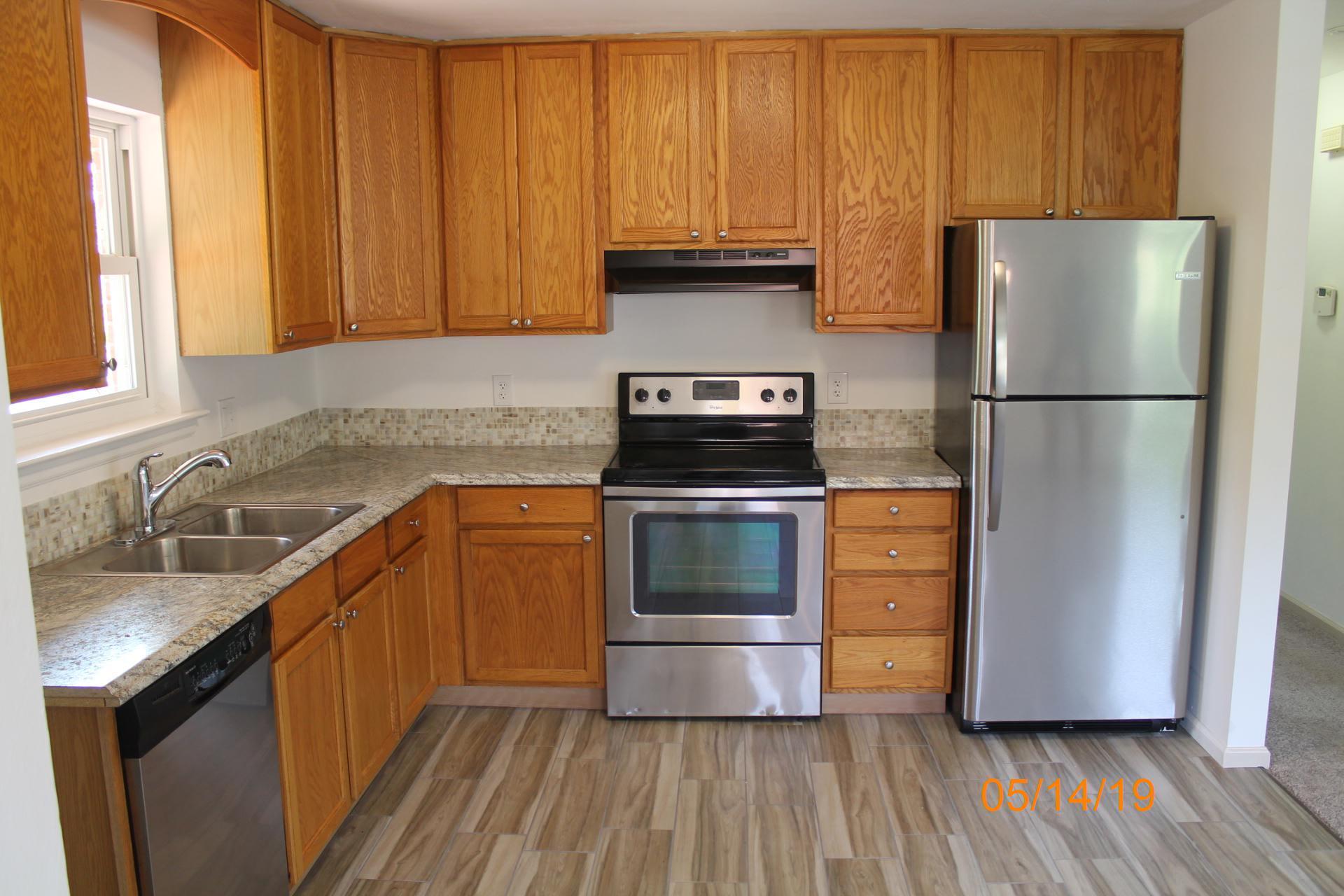 745 Kenyon Road Vinton, VA 24179 - Photo 27 of 52 a kitchen with a refrigerator sink and cabinets