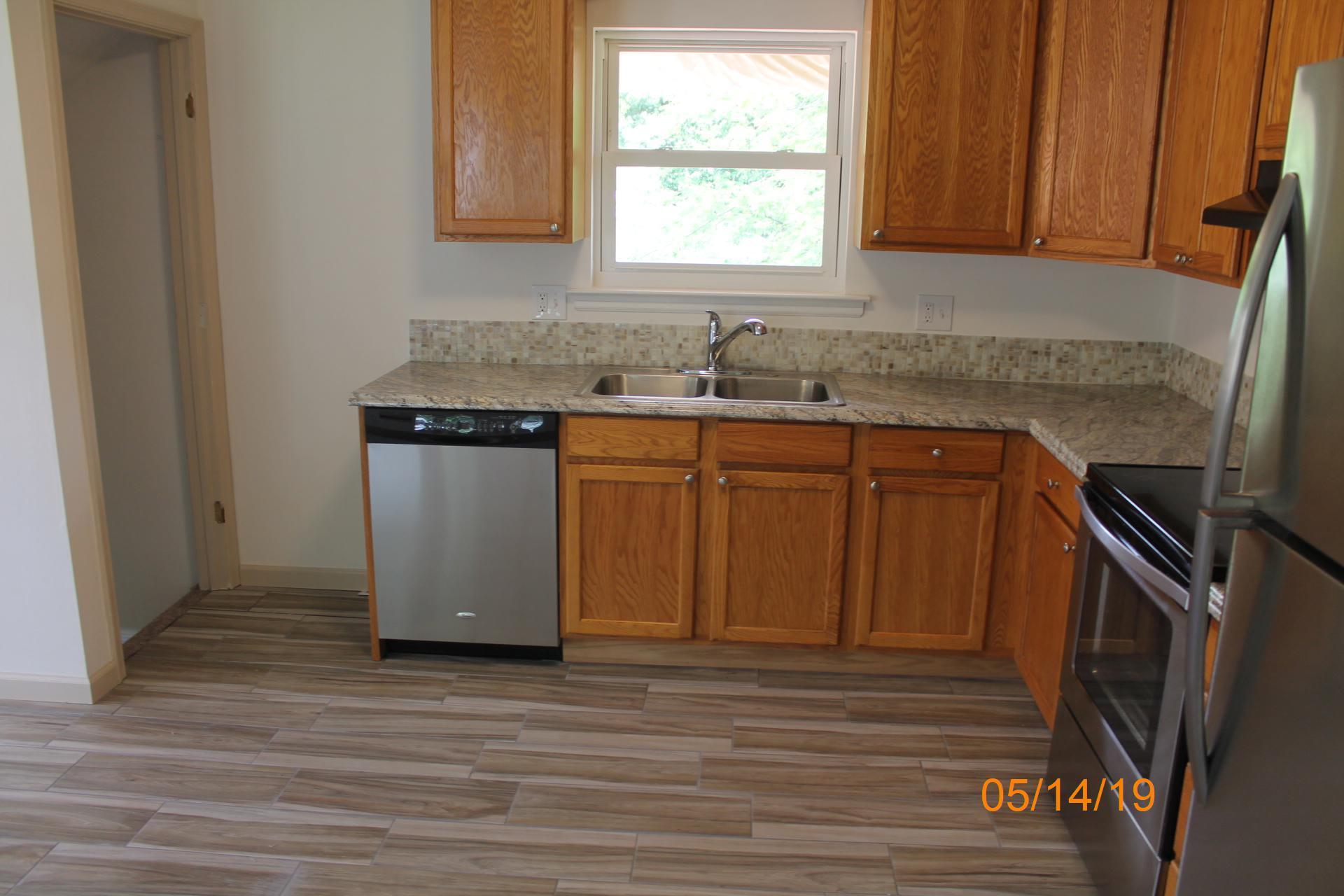 745 Kenyon Road Vinton, VA 24179 - Photo 30 of 52 a kitchen with stainless steel appliances granite countertop a sink and a stove