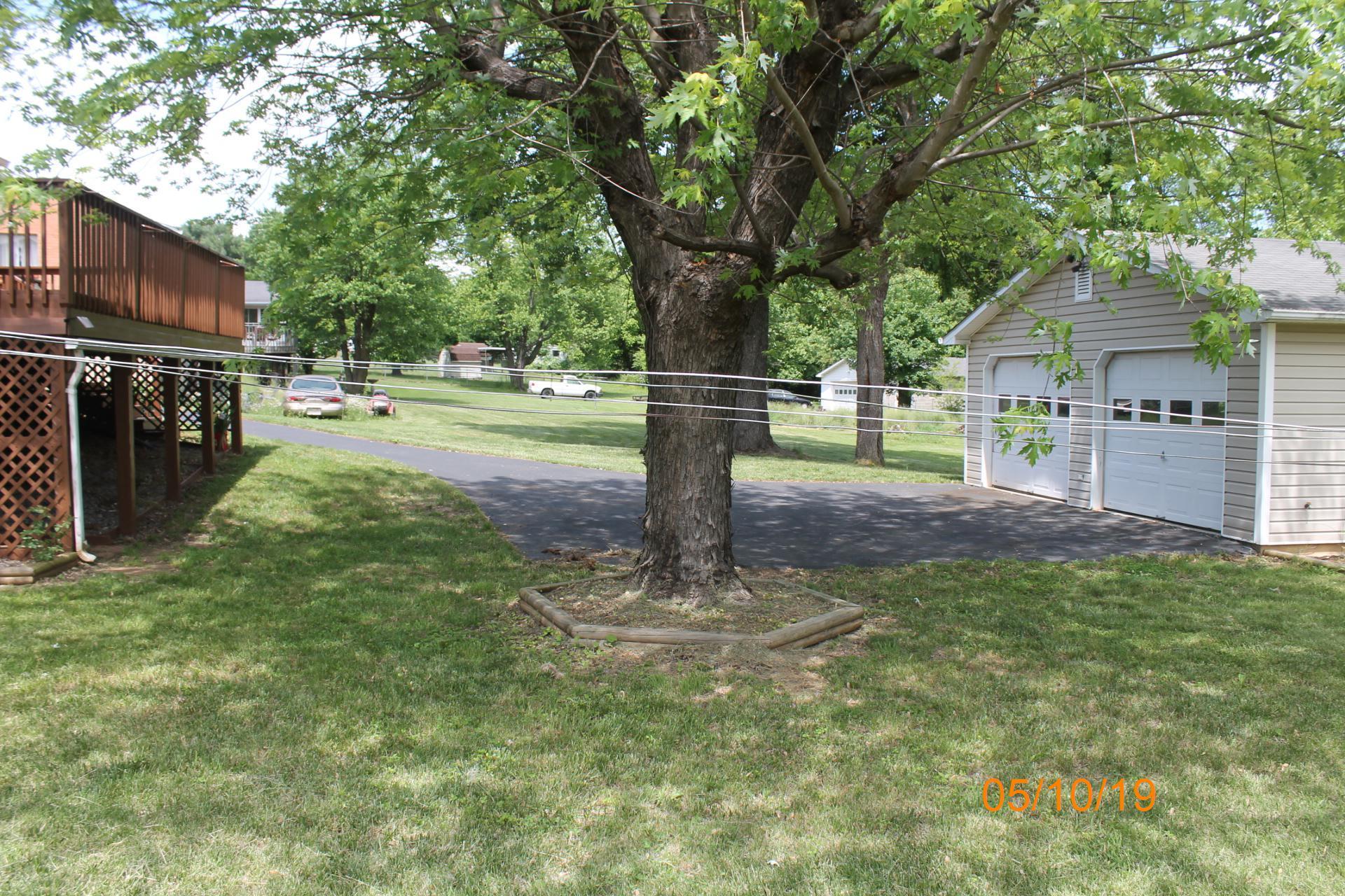 745 Kenyon Road Vinton, VA 24179 - Photo 5 of 52 a front view of a house with garden and trees
