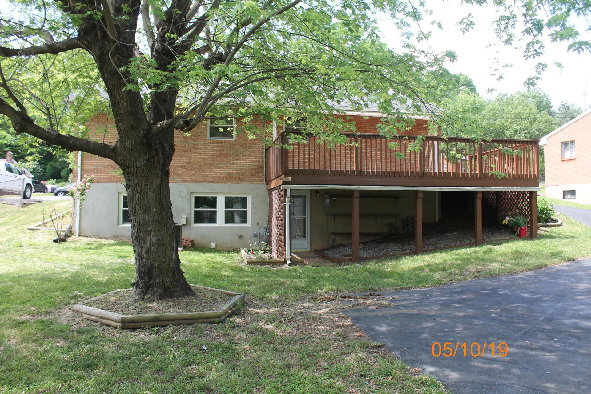 745 Kenyon Road Vinton, VA 24179 - Photo 7 of 52 a front view of a house with a yard