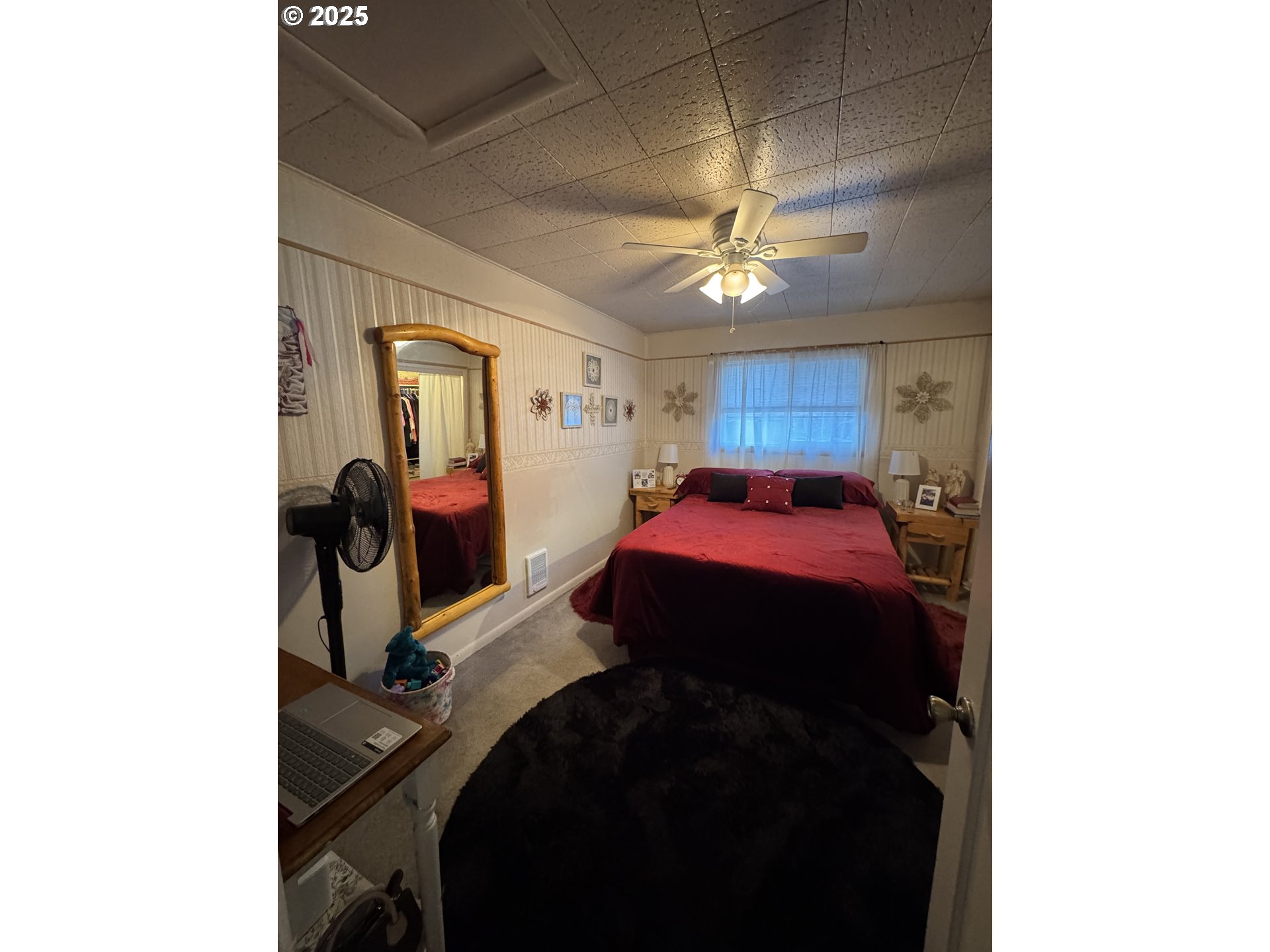 361 Bridge Street Echo, OR 97826 - Photo 8 of 13 a bed room with a bed and a chandelier