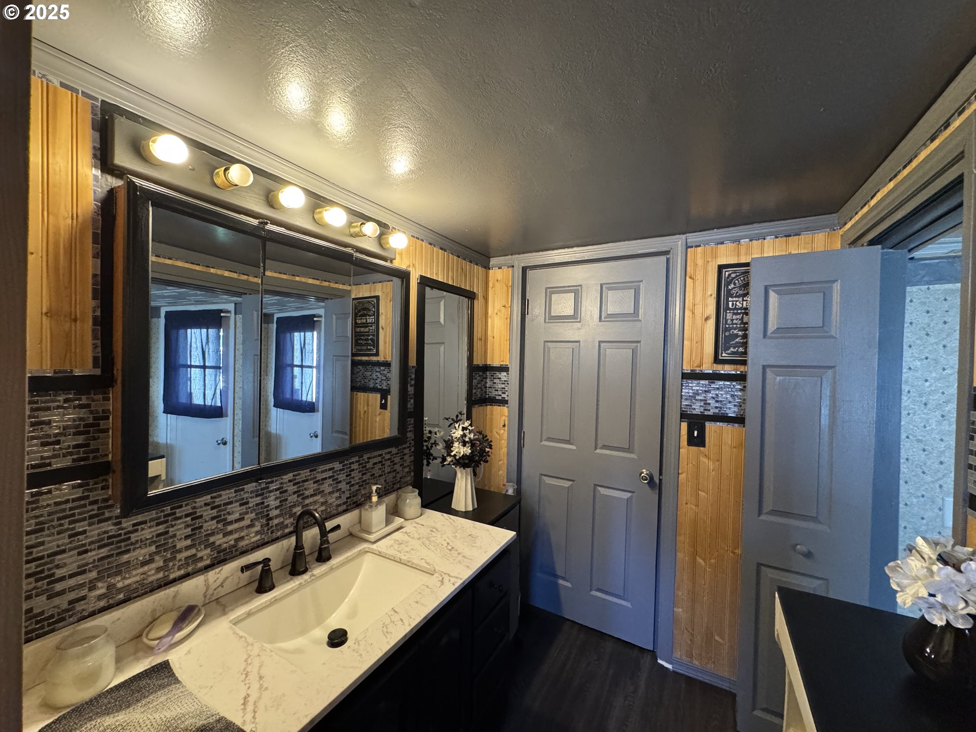 361 Bridge Street Echo, OR 97826 - Photo 10 of 13 a bathroom with a sink a large mirror and a shower