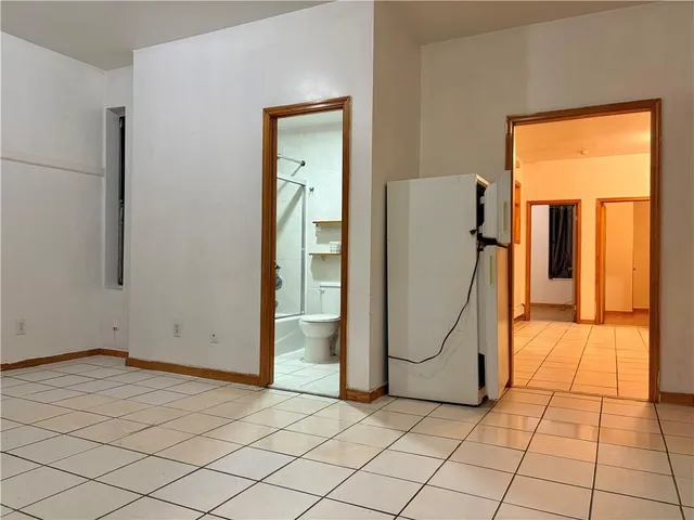 a bathroom with a toilet a sink and shower