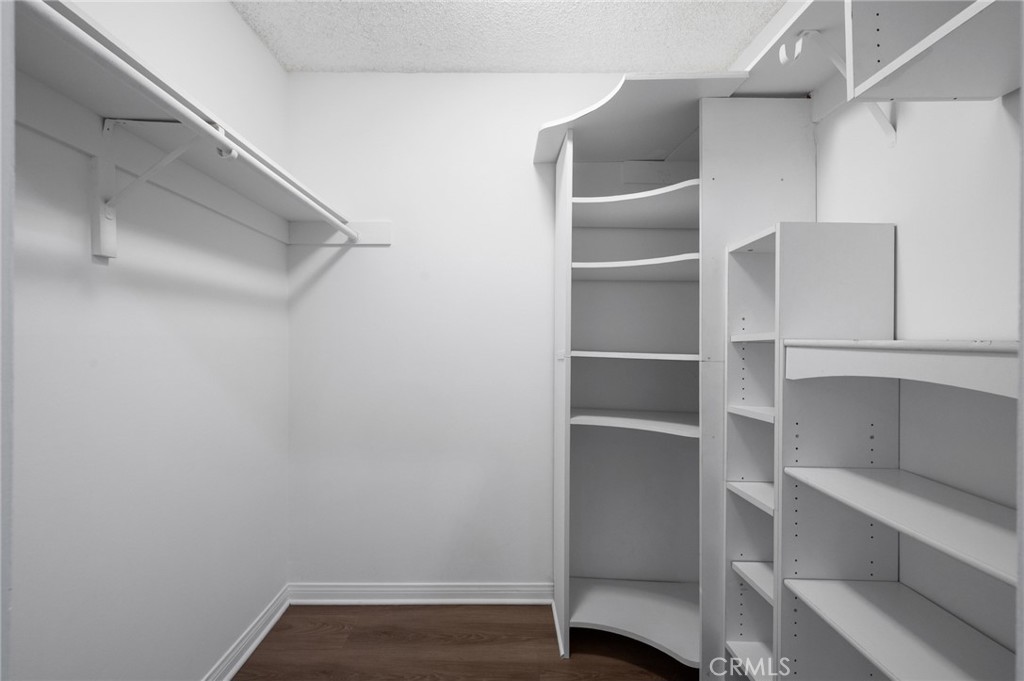 3604 West Estates Lane, Unit 117 Rolling Hills Estates, CA 90274 - Photo 16 of 36 a view of walk in closet with empty racks