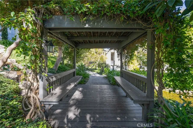 a view of a porch with furniture and garden