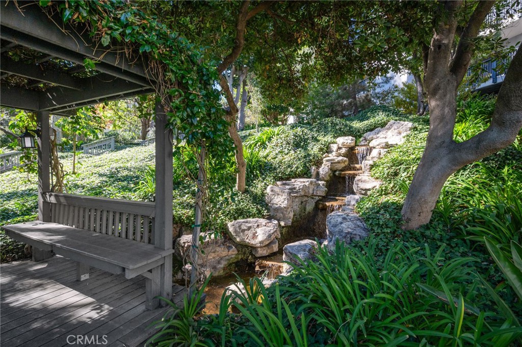 3604 West Estates Lane, Unit 117 Rolling Hills Estates, CA 90274 - Photo 22 of 36 a view of a porch with furniture and garden