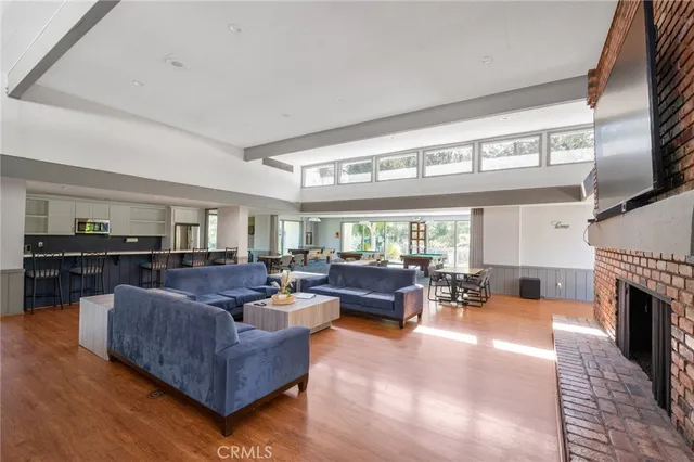 a living room with fireplace furniture and a flat screen tv