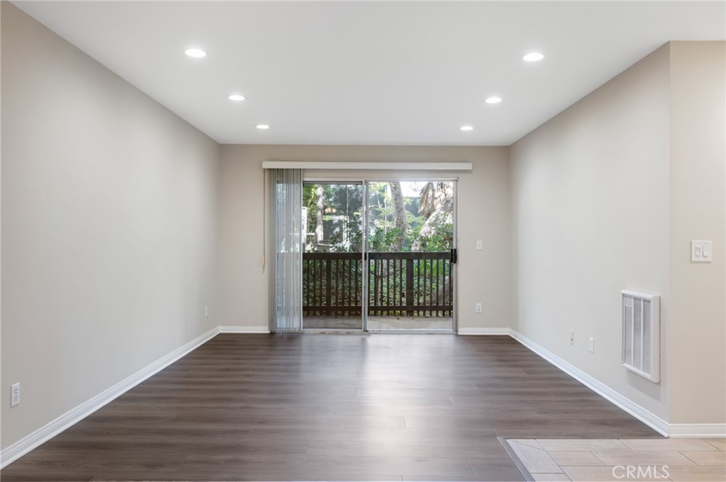 3604 West Estates Lane, Unit 117 Rolling Hills Estates, CA 90274 - Photo 4 of 36 a view of empty room with wooden floor