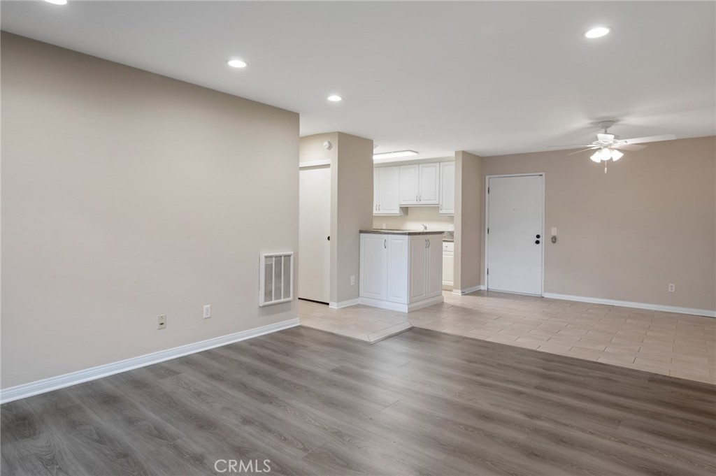 3604 West Estates Lane, Unit 117 Rolling Hills Estates, CA 90274 - Photo 6 of 36 a view of empty room with wooden floor and window