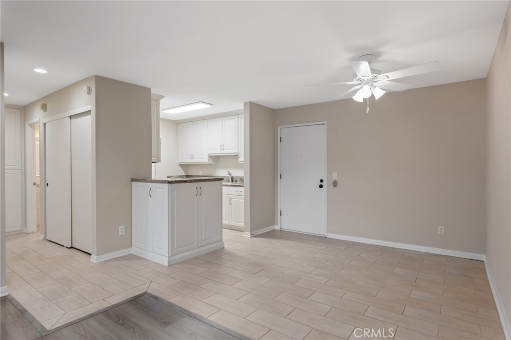 3604 West Estates Lane, Unit 117 Rolling Hills Estates, CA 90274 - Photo 7 of 36 a view of a kitchen with a sink and a refrigerator