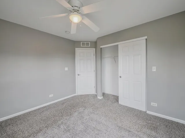 a bathroom with a sink a toilet and a large mirror
