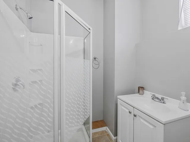 a bathroom with a sink and mirror