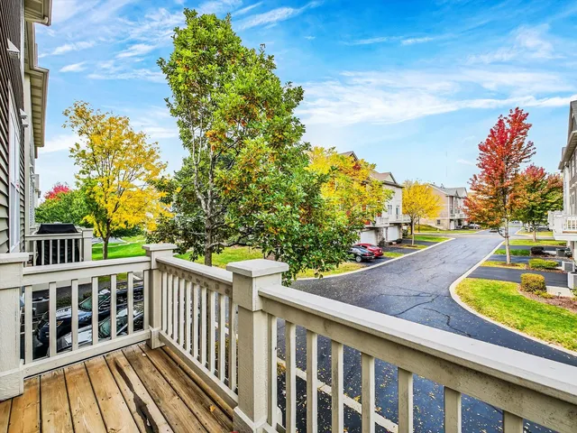 a view of a wooden deck and city view