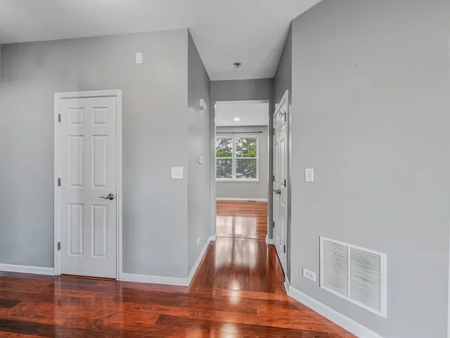 wooden floor in a hall with an entryway