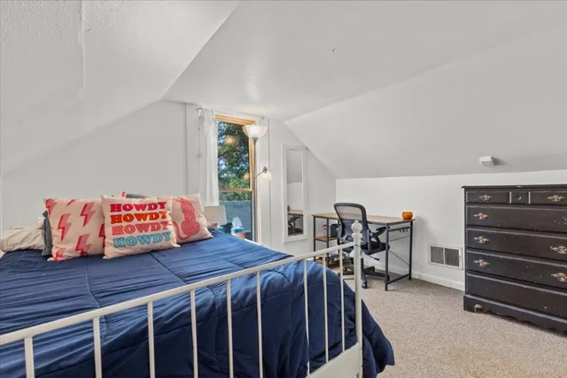 a bedroom with a bed and furniture