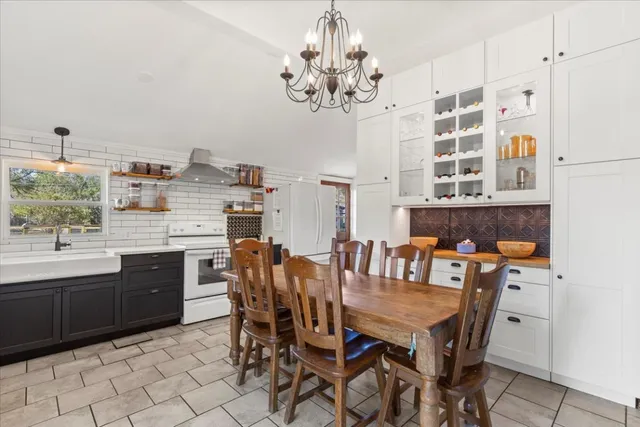 a dining room with furniture and window