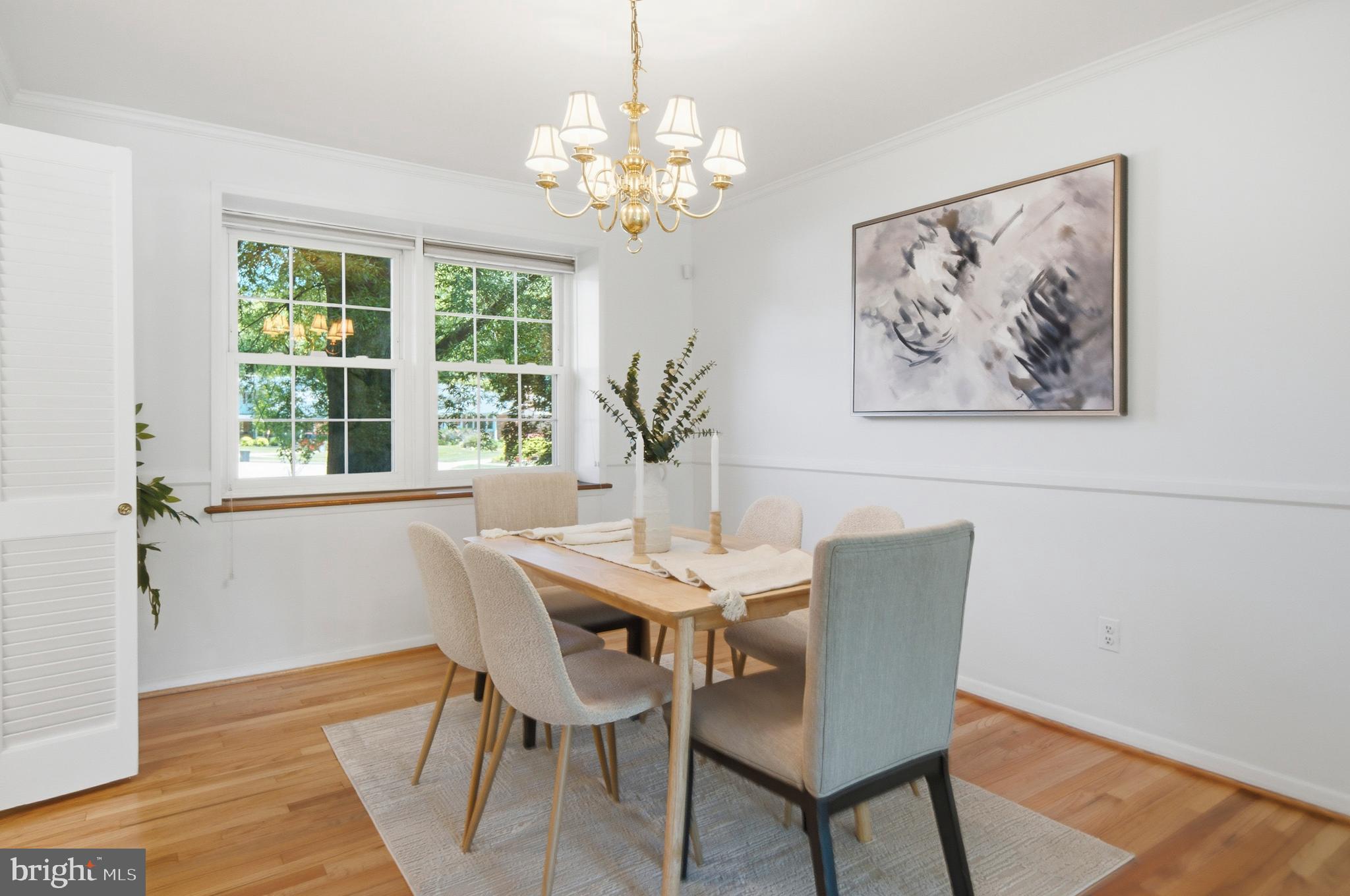 220 Solway Road Lutherville-Timonium, MD 21093 - Photo 7 of 38 a view of a dining room with furniture a chandelier and wooden floor