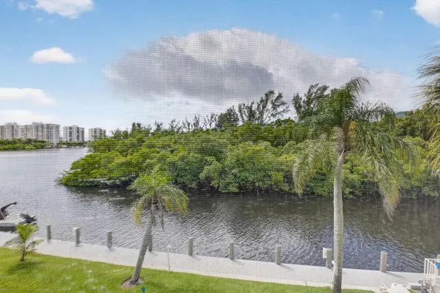 a view of a lake with a yard